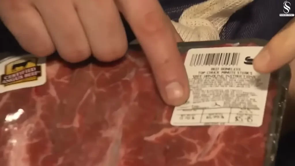 man's fingers pointing sell by date